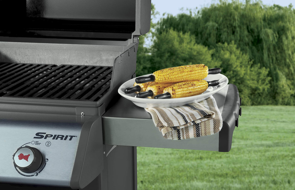 Weber corn pick set close-up shows comfortable grips and thumb grooves.