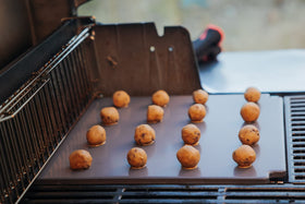 Weber Crafted Glazed Baking Stone on grill setup for versatile cooking