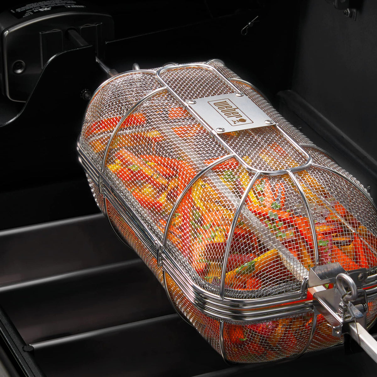 Weber Crafted Rotisserie Crisping Basket in use with even heat.