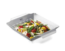Weber Deluxe grilling basket with seafood on grill for even browning.
