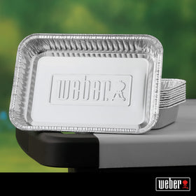Durable recyclable aluminum pans from Weber keep grilling area tidy.