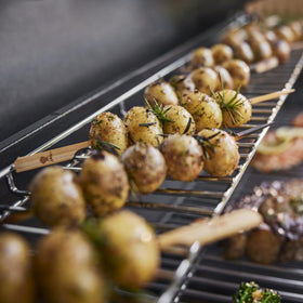 Weber Genesis S-315 grease management tray simplifies cleanup after grilling.