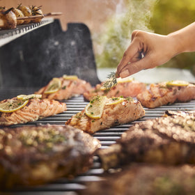 Weber Genesis S-315 warming rack and side tables add prep and warming space.