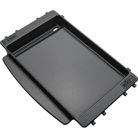 Weber griddle cleaning with ice cubes or water on a hot surface.