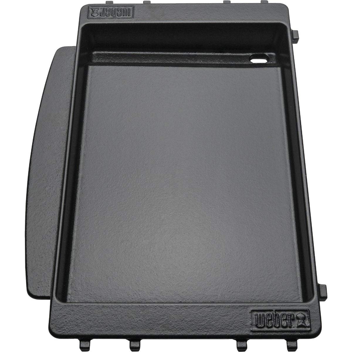 Weber griddle showing the drip drain directing drippings away from food.