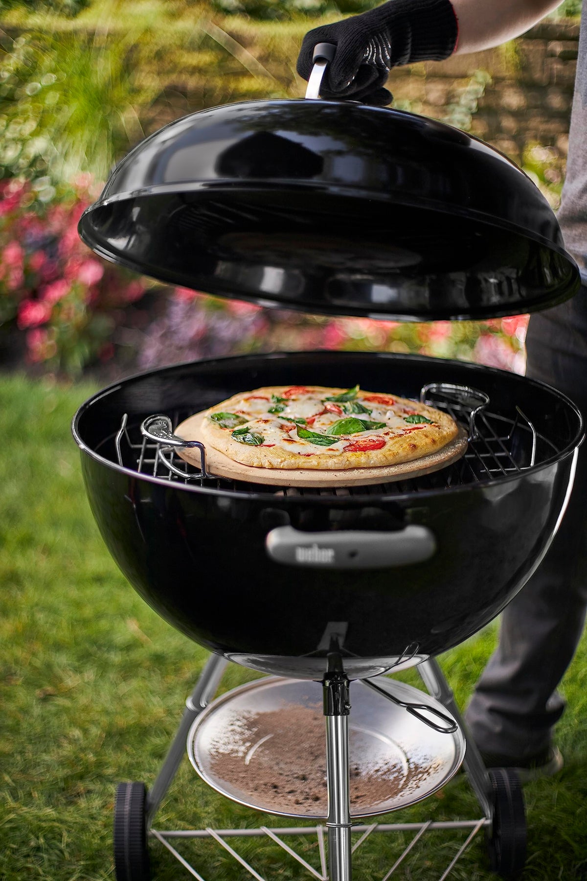 Weber grill setup with stone elevates homemade pizzas