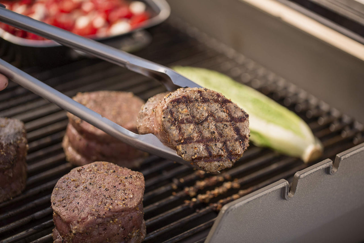 Weber grill tools complementing outdoor dining and backyard cooking.