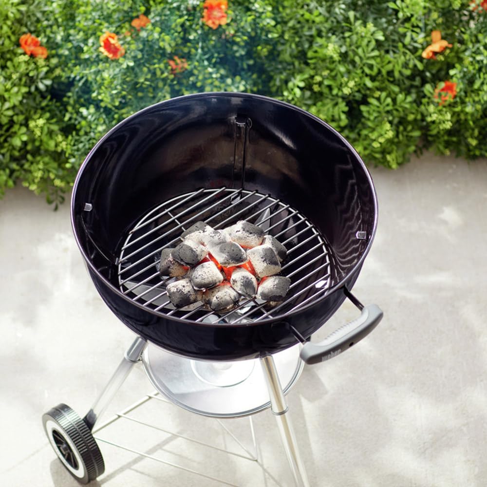 Weber heavy-duty plated steel charcoal grate supports consistent briquette arrangement.