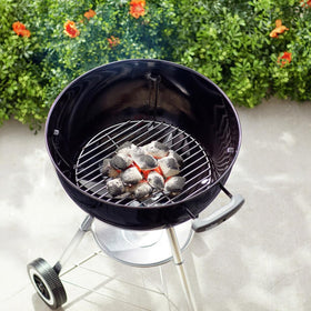 Weber heavy-duty plated steel charcoal grate supports consistent briquette arrangement.