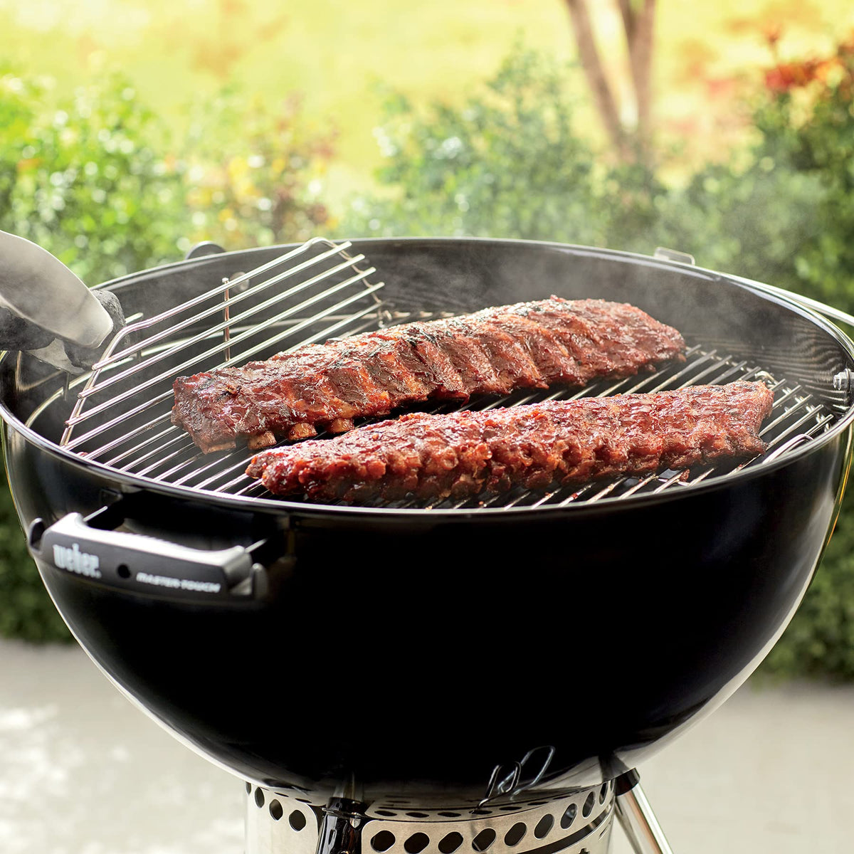 Durable plated steel construction suited for frequent outdoor grilling with Weber grate.