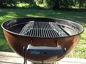 Grate rests securely on upper prongs for stable grilling on a Weber 22-inch grill.