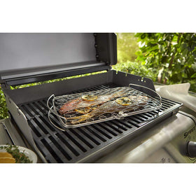 Weber large fish basket elevates food from grates for even cooking.
