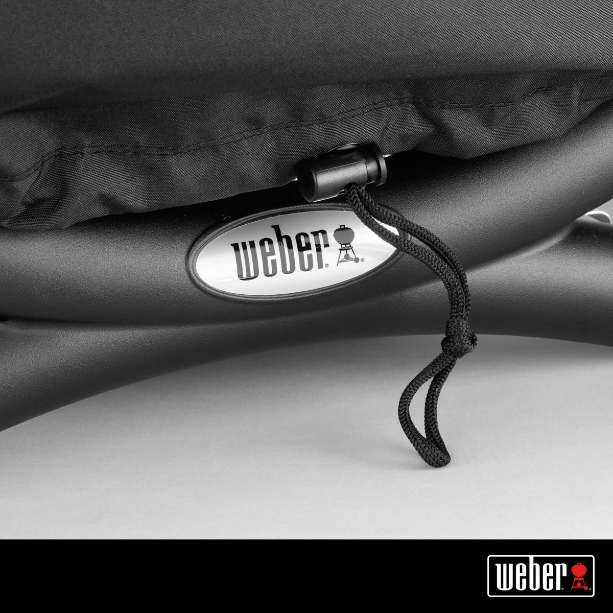 Weber Premium Bonnet Cover snugly fits Q1000-series grills for outdoor protection.