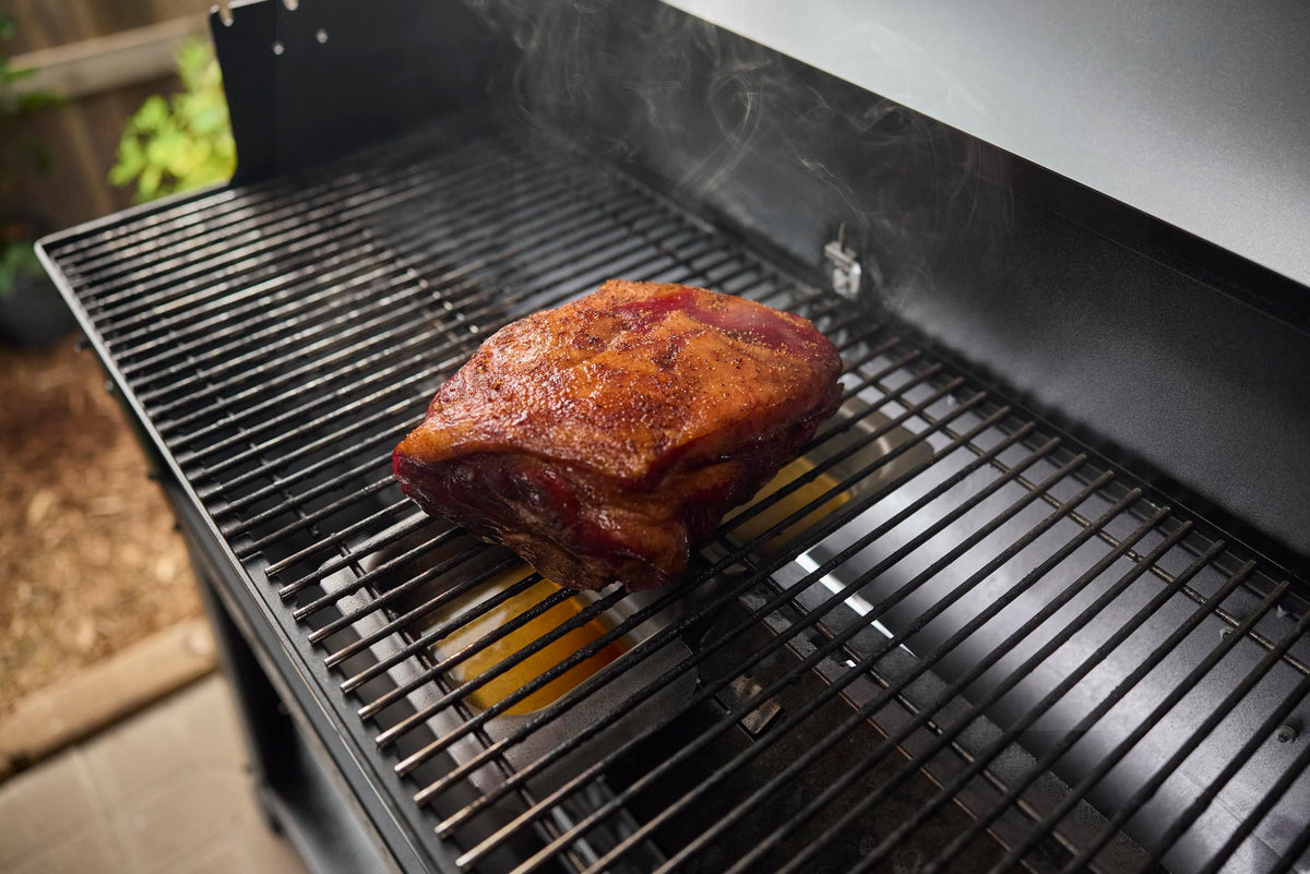 Weber Searwood Wet Smoke Pan on Flavorizer bar for indirect heat cooking.