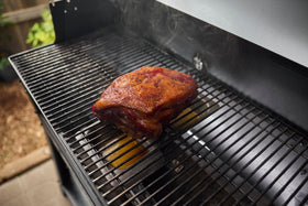 Weber Searwood Wet Smoke Pan on Flavorizer bar for indirect heat cooking.