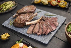 Weber Spirit E-425 side tables offering convenient storage and prep space.