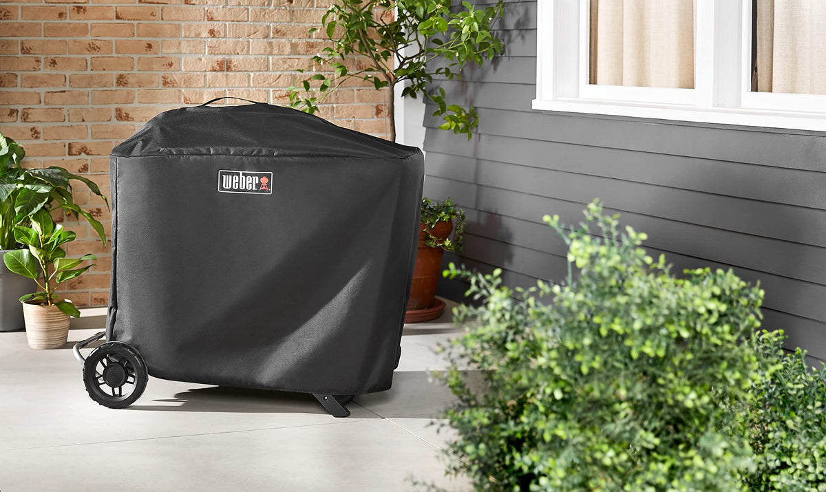 Weber Traveler Premium covers upright grill outdoors for weather protection