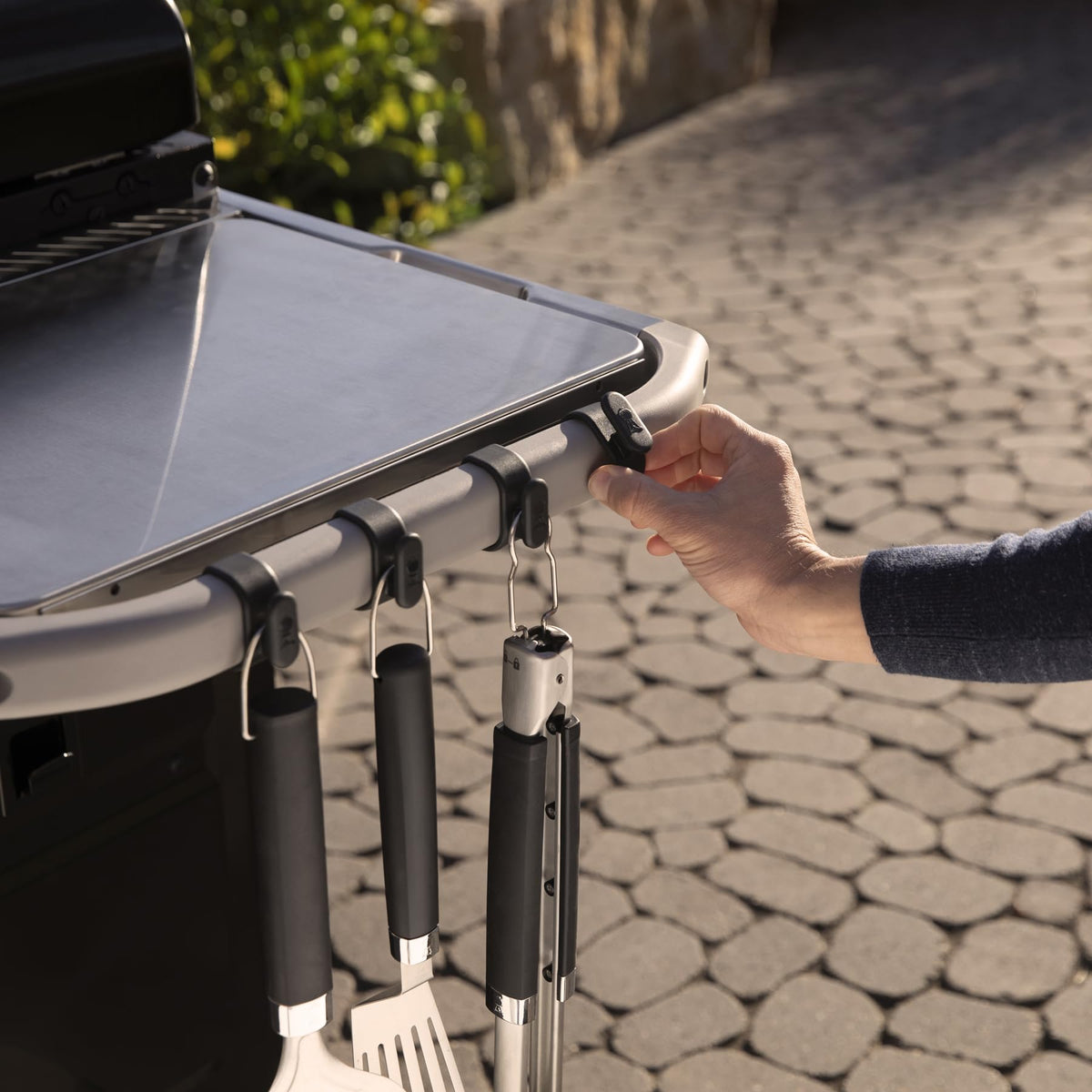 Weber Works paper towel holder provides wind guards to prevent unraveling while cooking.
