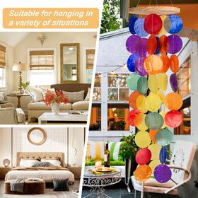 WeDoSoy wind chimes light and shadow dancing through translucent shells.