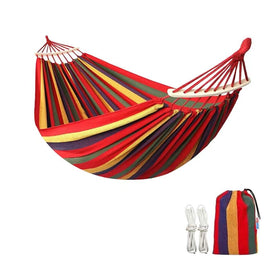 WeiTrust cotton canvas hammock in rainbow finish offers comfy, durable outdoor lounging.