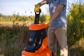 WEN 41130 13-gallon collection bin keeping yard cleanup tidy.