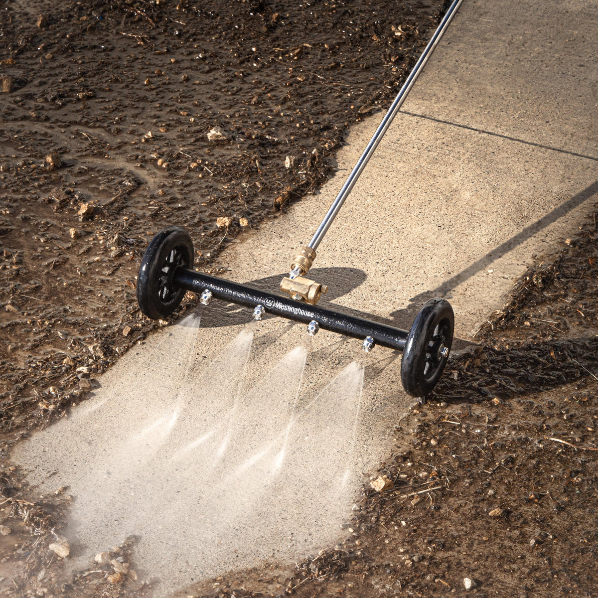 Water broom in use on a driveway with Westinghouse PWUC 16.