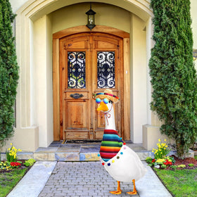Weysat lawn goose wearing the outfit in a sunny garden setting