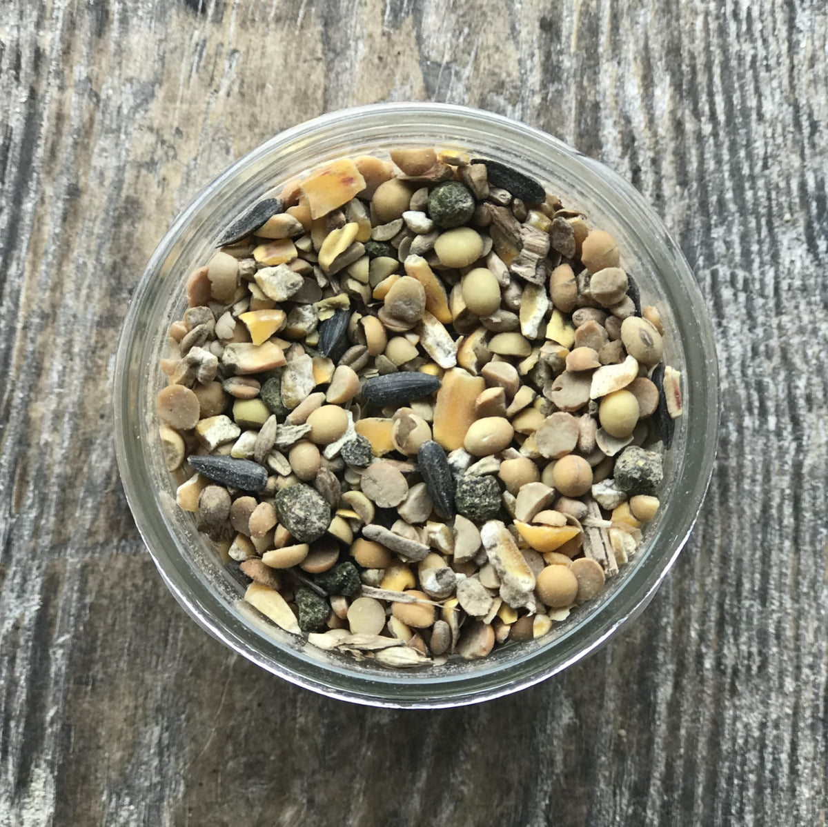 Wholesome Harvest 24% protein game bird feed close-up highlighting dense kibble for robust development.