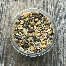 Wholesome Harvest 24% protein game bird feed close-up highlighting dense kibble for robust development.