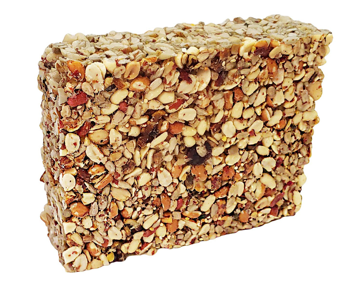 Wildlife Sciences Songbird Seed Cake 8 oz display at feeder