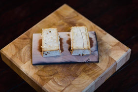 Wildwood Grilling cedar plank presentation enhances dish aesthetics.
