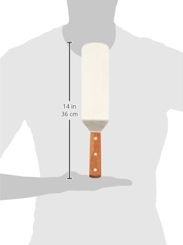 Winco turner with offset handle keeps hands away from heat while flipping thick steaks.