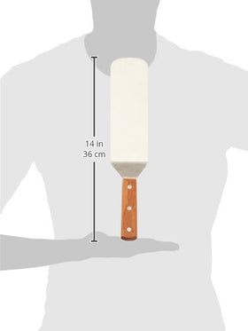 Winco turner with offset handle keeps hands away from heat while flipping thick steaks.