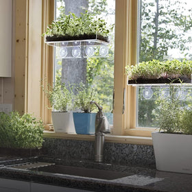 Window Garden sturdy, easy-to-clean shelf enhances small kitchens and offices