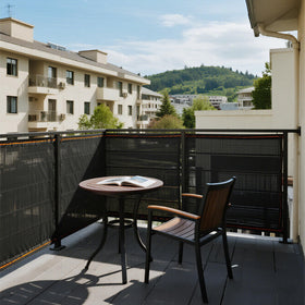 Winemana breathable mesh shade cloth on a patio delivering cooler outdoor shade.