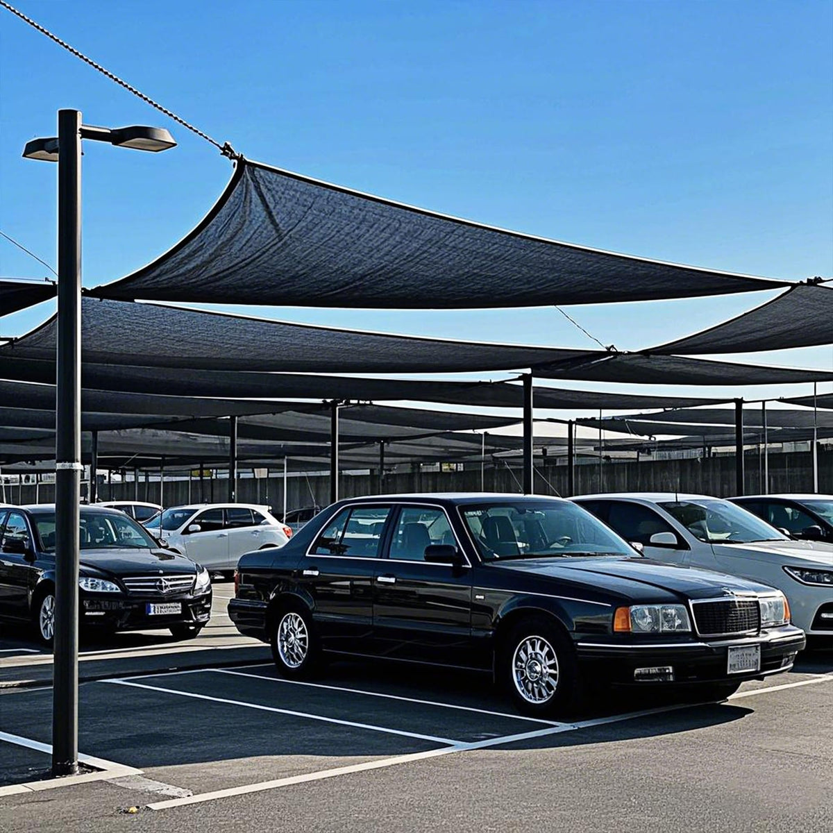 Winemana shade cloth used for greenhouse plant protection and airflow.