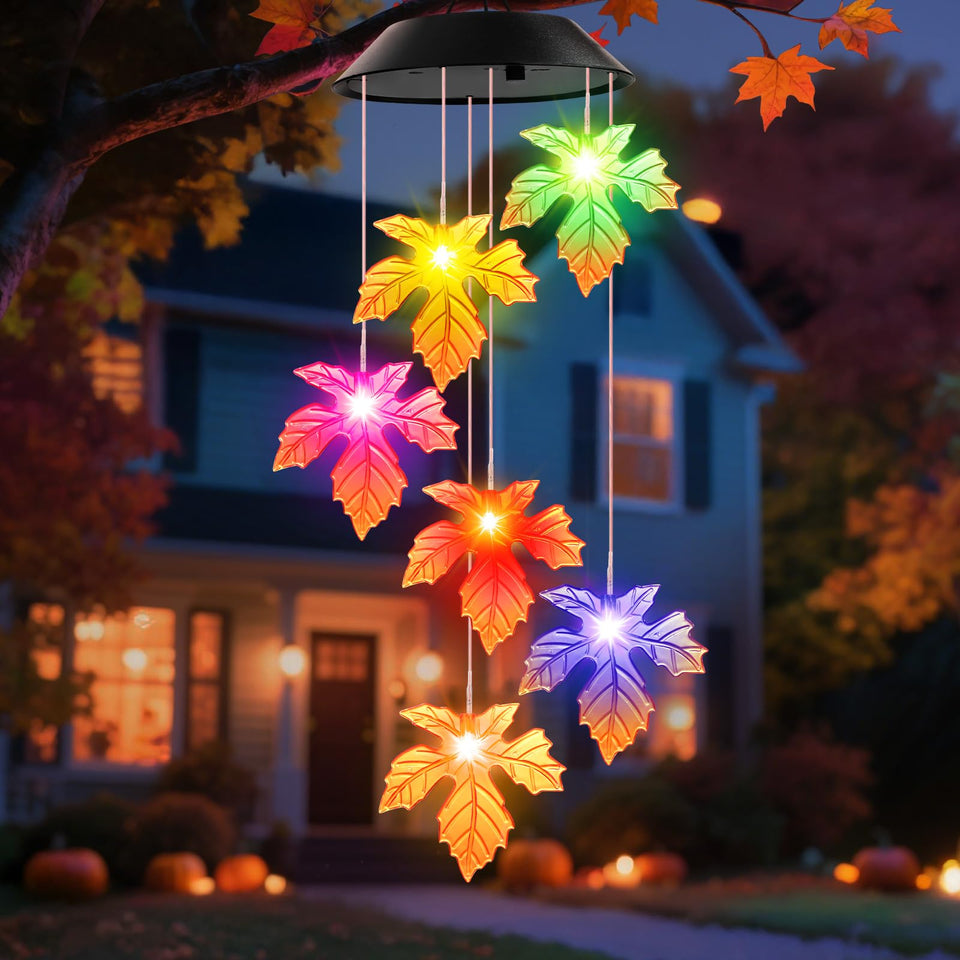 Winzwon Maple Leaves wind chimes outdoors with solar glow at night