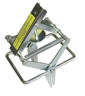 Wire Tek 1001 EasySet trap positioned in a mole tunnel for quick, no-dig setup