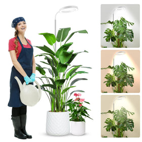 Wolezek Grow Light 65-inch full-strip illuminates a row of indoor plants.