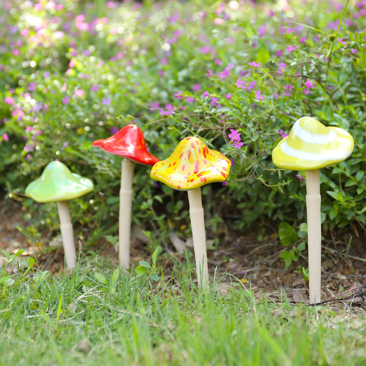 Wonder Garden hand-painted mushrooms enhancing fairy garden scenes with color.