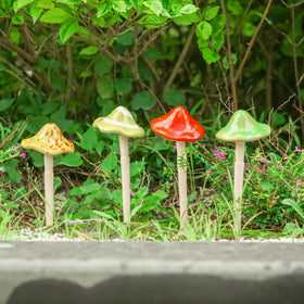 Wonder Garden outdoor mushroom stakes with glazed finishes for patios.