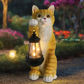 WONDER GARDEN solar cat statue with lantern lighting your garden at dusk.
