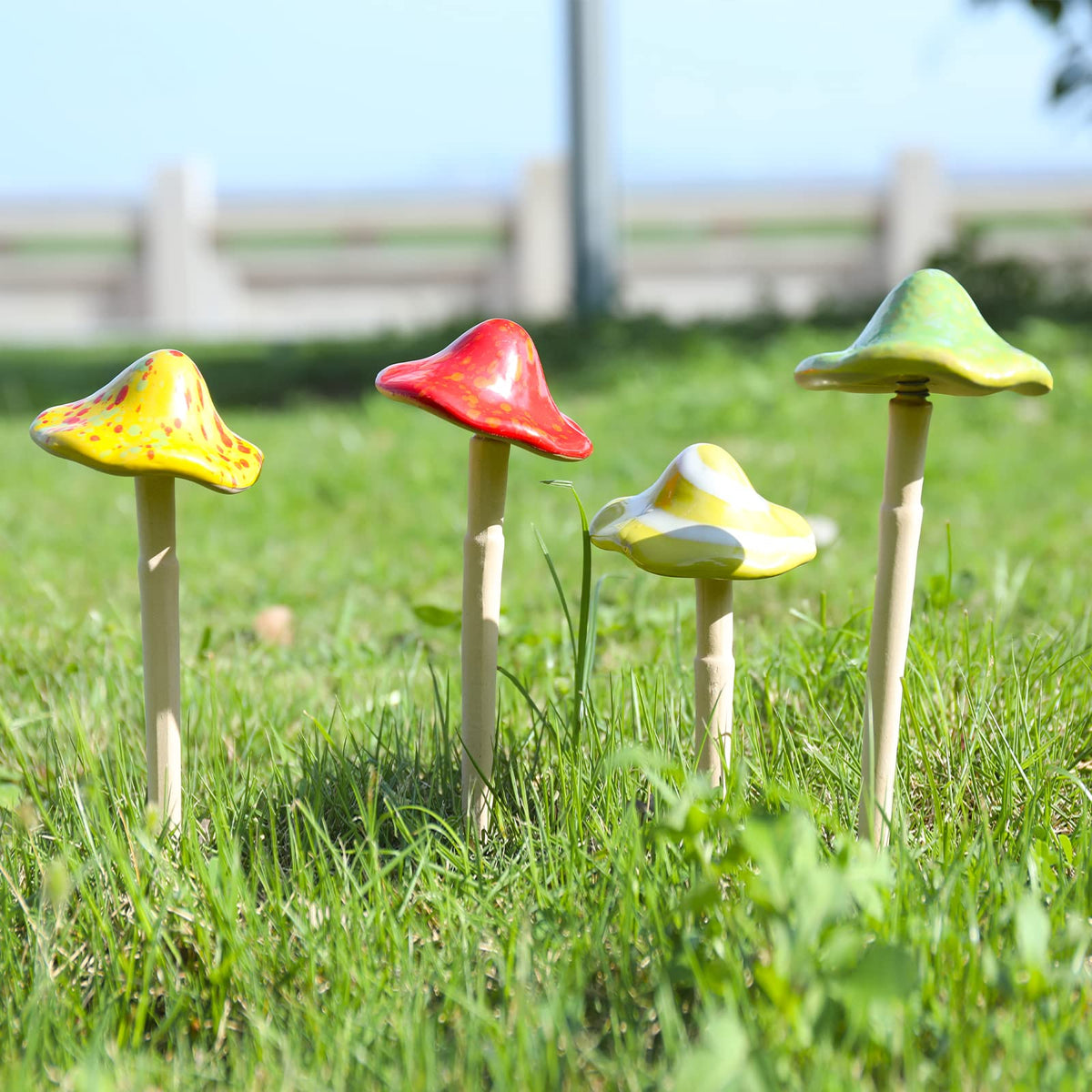 Wonder Garden terracotta ceramic mushrooms used as lawn accents and pot decor.