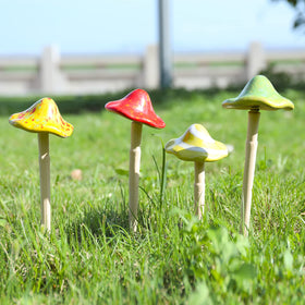 Wonder Garden terracotta ceramic mushrooms used as lawn accents and pot decor.