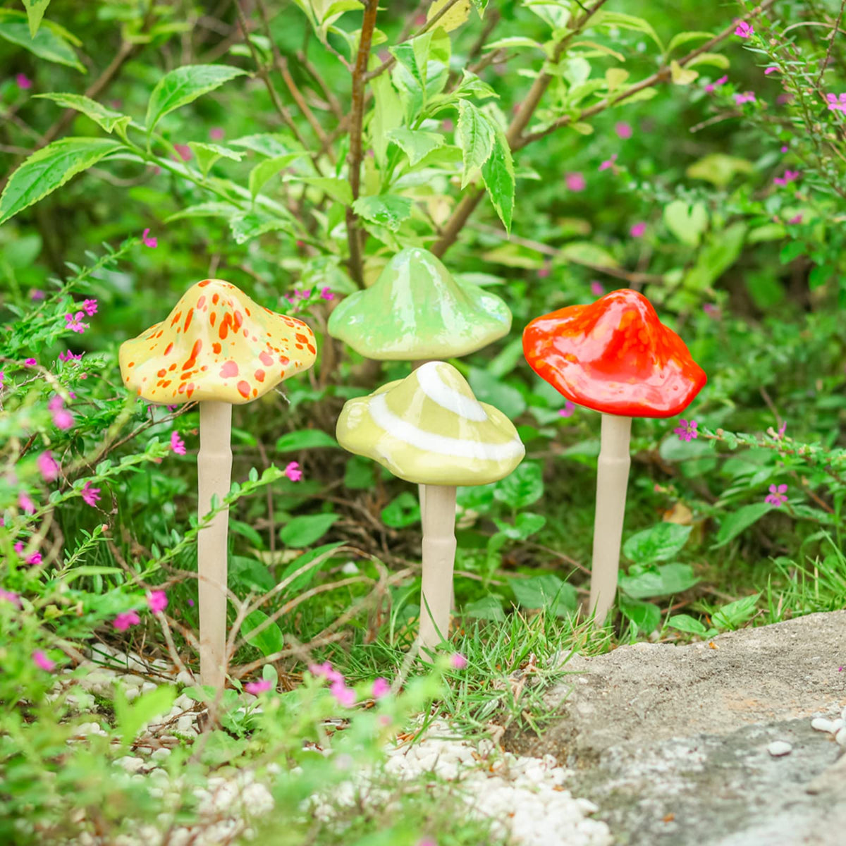 Wonder Garden mushroom statues adding whimsical charm to garden pathways.
