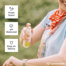 Wondercide lemongrass bottle with natural ingredients and leaves.