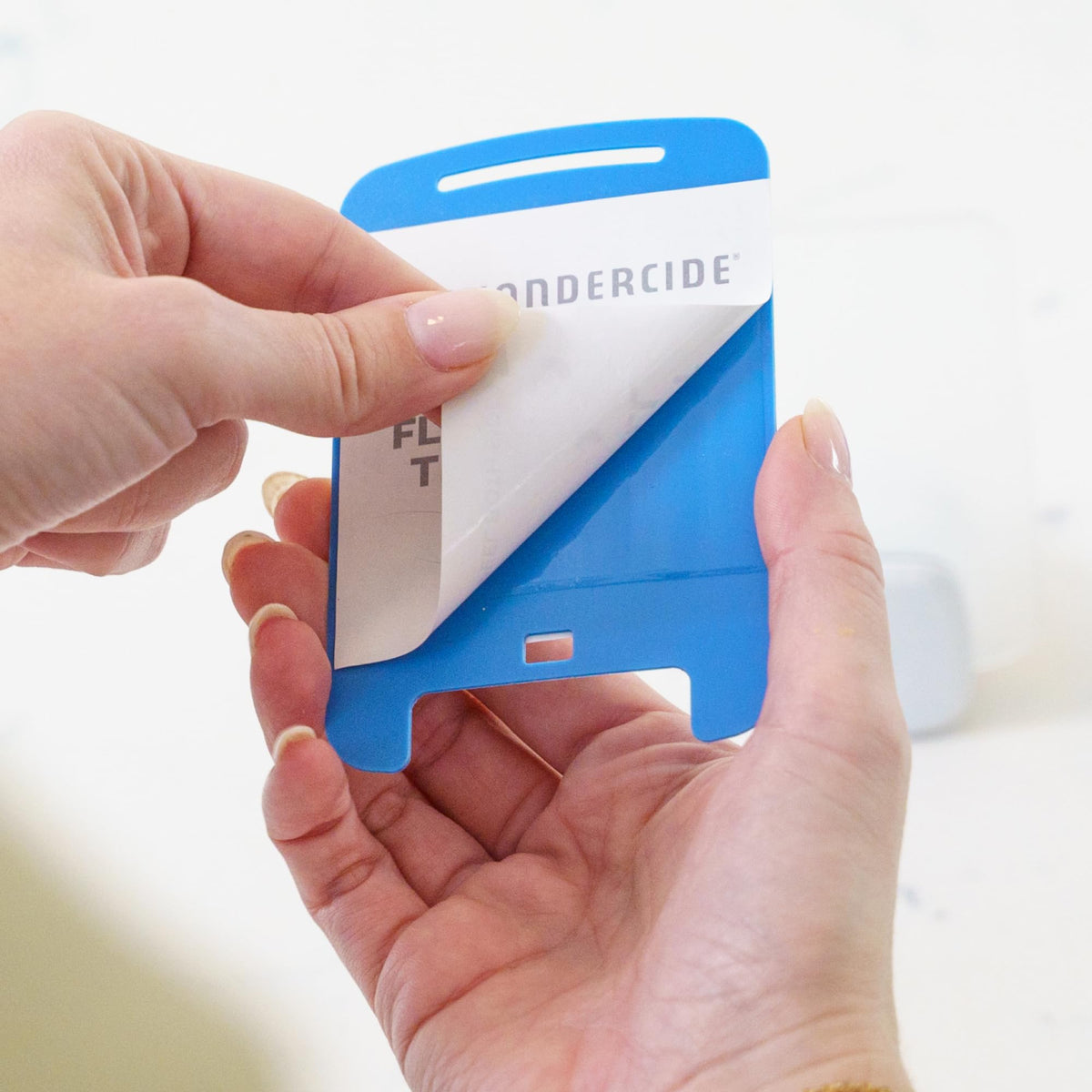Wondercide refill being inserted into trap for easy replacement