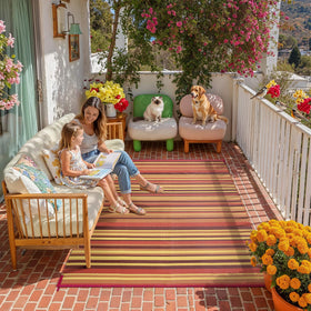 WondRg rug on patio deck adds vivid red-orange stripes for sunny gatherings