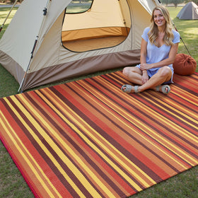 WondRg waterproof striped rug on deck; easy to rinse for quick cleanup.