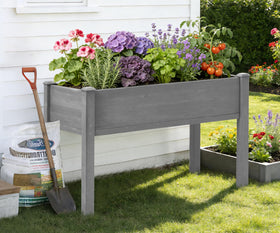 Wood-Natrl elevated planter box stand with liner supports tidy soil and drainage.